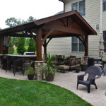 covered patio with landscaping