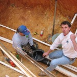 Iinstalling the bottom drain in a Raleigh, NC pond