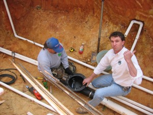 Iinstalling the bottom drain in a Raleigh, NC pond